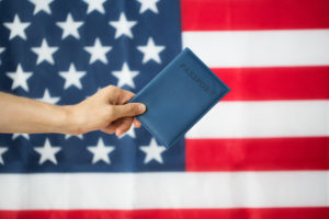 Passport in front of American flag